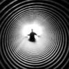 Grayscale Photography of Person at the End of Tunnel