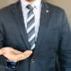 Man in Black Coat, White Dress Shirt and Black, Gray and White Necktie