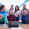 woman in maroon sweater using laptop